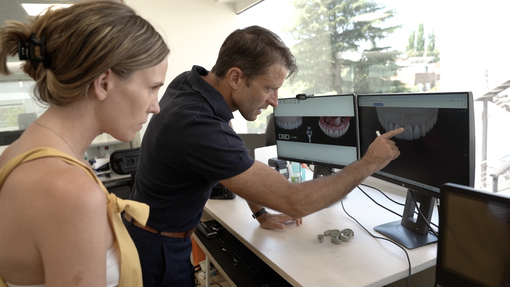 Christian examines a digital design in the lab