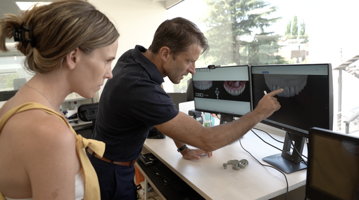 Christian examines a digital design in the lab