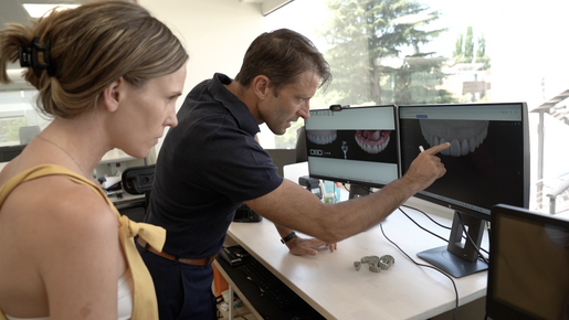 Christian examines a digital design in the lab