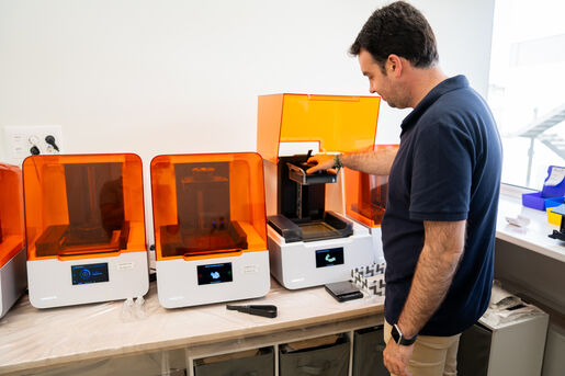 IMPLEMENT DSD PLANNING CENTER LAB SERVICES DSD Lab working on printer