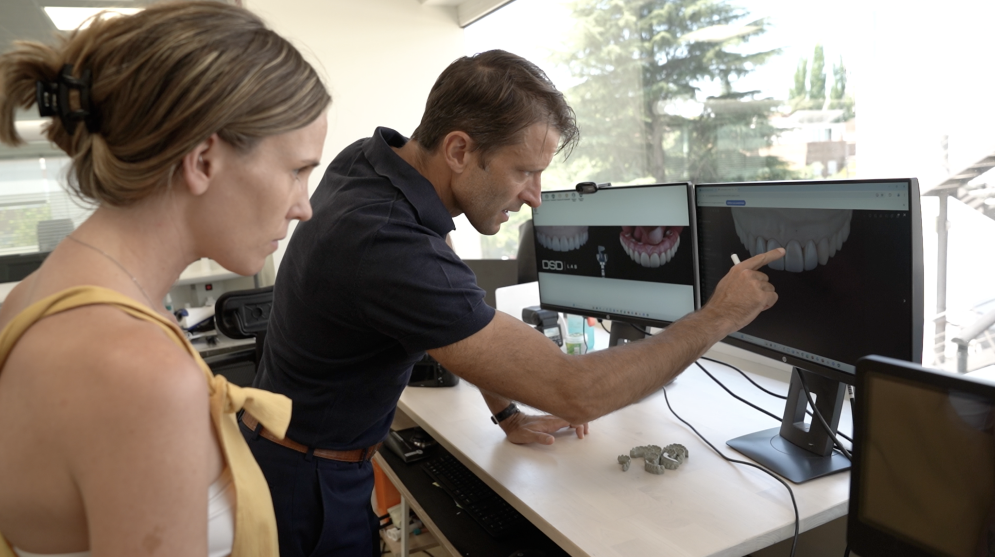 Christian Coachman examines a digital design in the dental lab